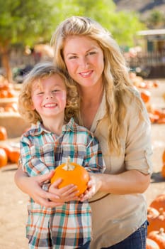 Adorable Young Family Enjoys a Day at the Pumpkin Patch.