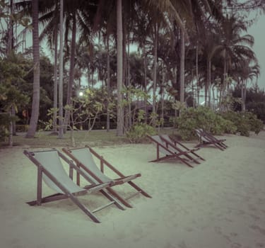 Row of beach chair on beach in vintage color style