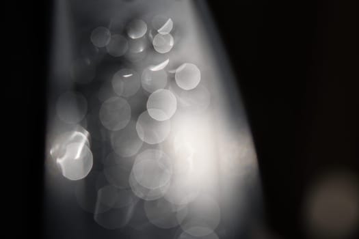 Water drops Abstract and with blurred background shines on a metal surface of a chair. Abstract macro shot
