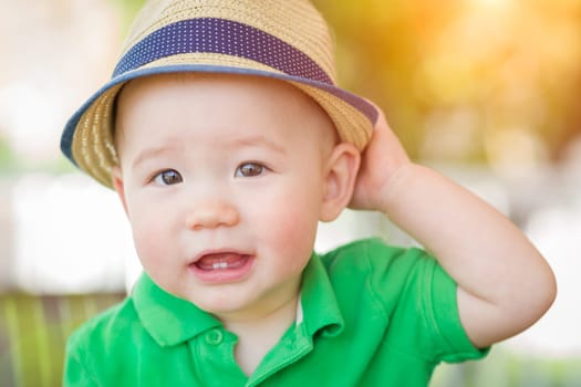 Portrait of A Happy Mixed Race Chinese and Caucasian Baby Boy Wearing His Hat