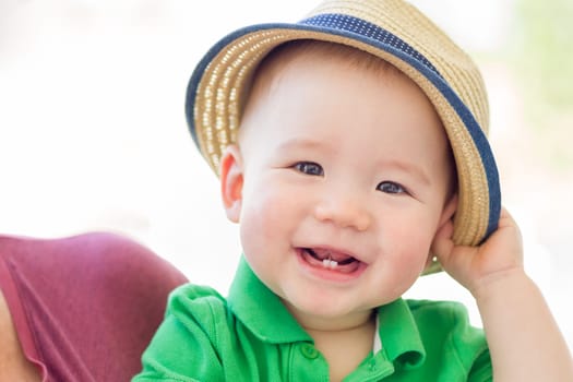 Portrait of A Happy Mixed Race Chinese and Caucasian Baby Boy Wearing His Hat