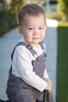 Young Mixed Race Chinese and Caucasian Baby Boy Having Fun Outdoors