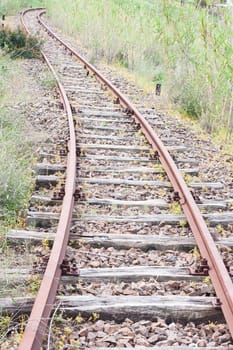 Old abandoned rail tracks, concept of what's around the corner