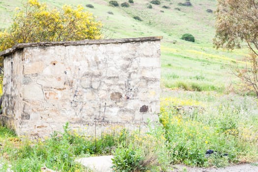 Littlle abandoned house stone in countryside in Sardinia