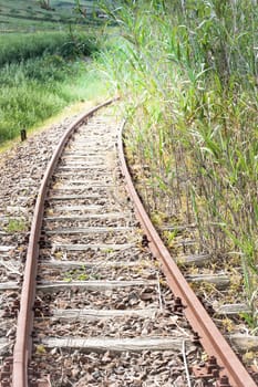 Old abandoned rail tracks, concept of what's around the corner