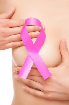 Woman with a pink breast cancer awareness ribbon