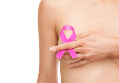 Woman with a pink breast cancer awareness ribbon