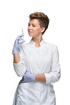 Portrait of lady surgeon holding in his hand syringe isolated on white background