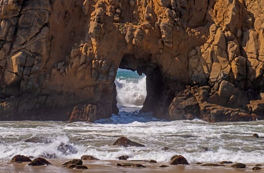 Waves Heading in an Sea Arch at Pfeiffer Beach in California
