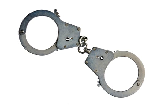 Metal handcuffs on a white isolated background, copy space. High quality photo