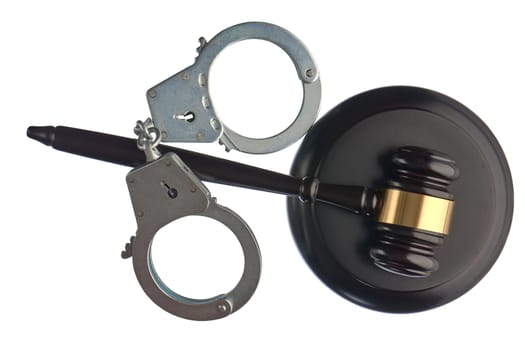 Judge's hammer and handcuffs on white isolated background. High quality photo