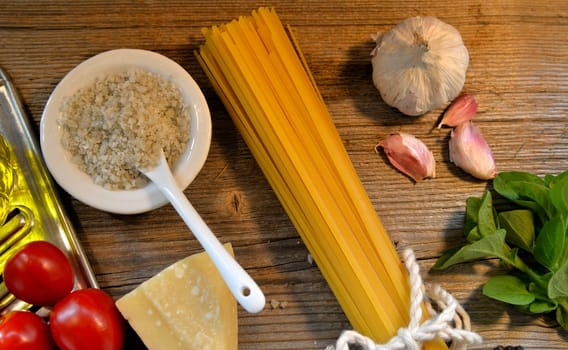 Pasta Tomatoes Parmesan on wood background