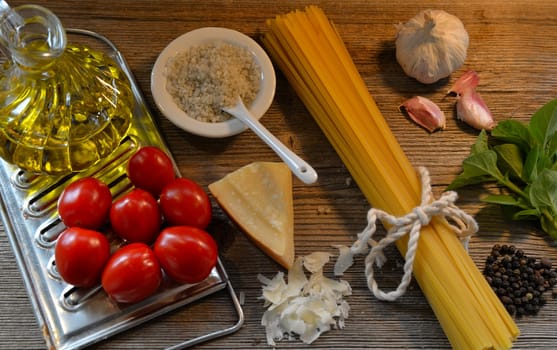 Pasta Tomatoes Parmesan on wood background