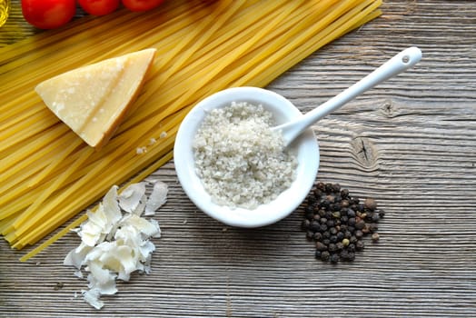 Pasta Tomatoes Parmesan on wood background