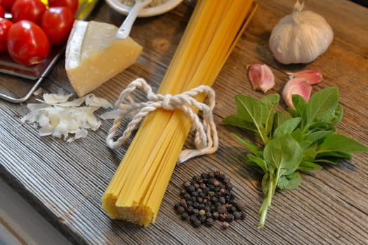 Pasta Tomatoes Parmesan on wood background