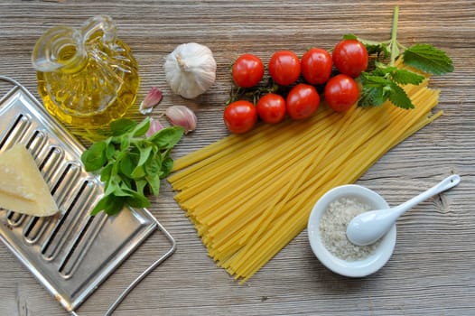 Pasta Tomatoes Parmesan on wood background