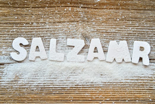 Salt on wooden board