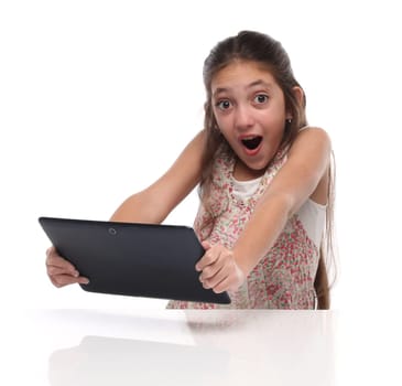 Surprised pre-teen girl with a tablet computer. Isolated on white