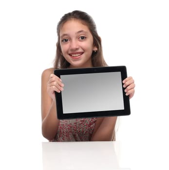 Beautiful pre-teen girl with a tablet computer. Isolated. Clipping path for the screen