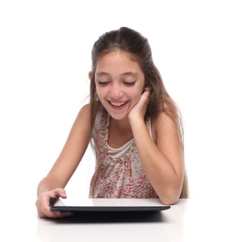 Beautiful pre-teen girl with a tablet computer. Isolated. Clipping path for the screen
