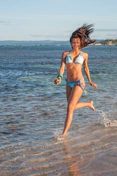 Beautiful and sexy girl posing on the beach in dominican republic