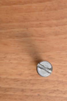 One bolt on wood blur background