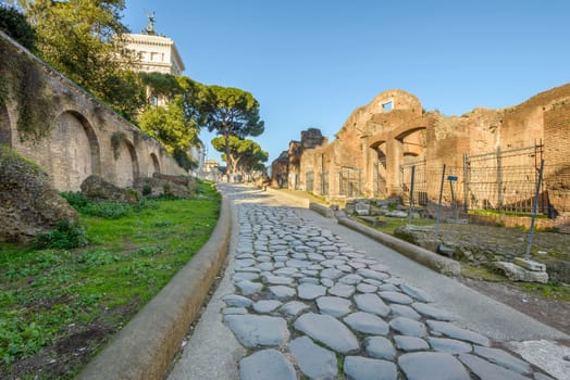 Ruins buildings and statue in the foro romano in Rome italy