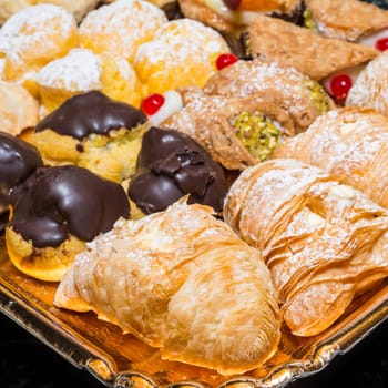 colorful pastries with fruits, cream and chocolate, the real Italian confectionery