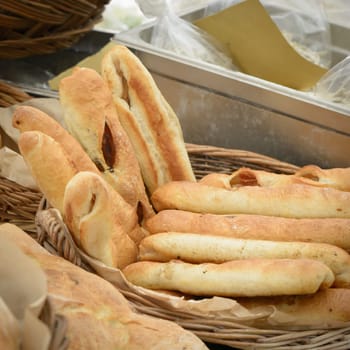 The typical Italian bread for sale to the market, in the baskets of straw