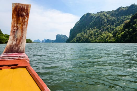 Prow of the long tail boat is traveling at sea in Phang Nga Bay or Ao Phang Nga National Park, Thailand