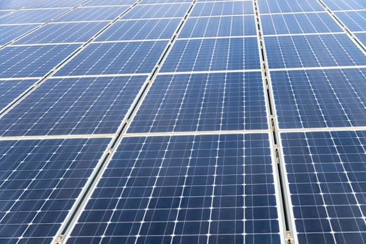 Photovoltaic panels on the roof . Roof Of Solar Panels. View of solar panels (solar cell) in the roof house with sunlight