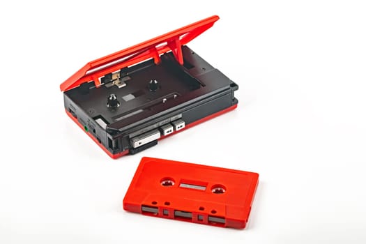 Beautiful red vintage audio cassette player over white background