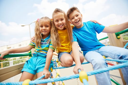 Cute friends having fun on playground