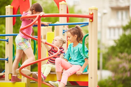 Friendly girls spending weekend on playground