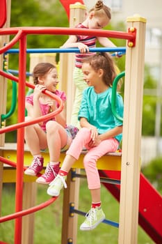 Friendly kids having fun on playground