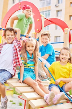 Little friends spending leisure on playground