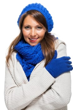 attractive pretty young woman with blue wool hat with long dark hair in winter isolated on white background