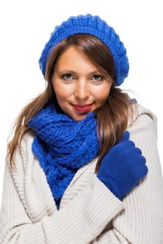 attractive pretty young woman with blue wool hat with long dark hair in winter isolated on white background