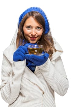 Young woman with dark hair and blue wool lyant drink a cup of tea to be isolated on white background