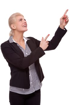 Young woman in business clothes shows with both arms in one direction isolated on white background