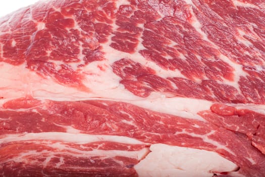 Fresh beef on a piece of roast beef greasy mixed marbled insulated on white background