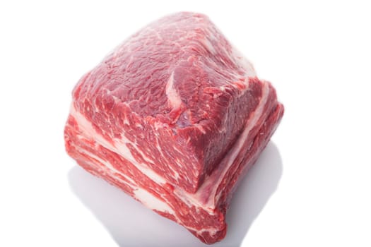 Fresh beef on a piece of roast beef greasy mixed marbled insulated on white background