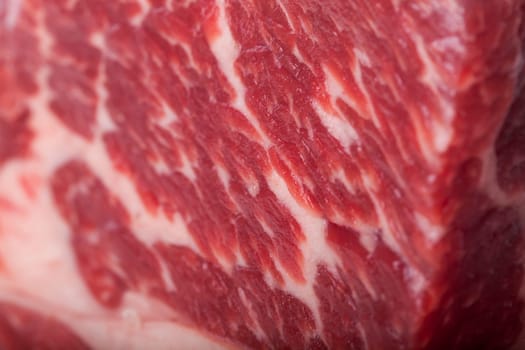 Fresh beef on a piece of roast beef greasy mixed marbled insulated on white background