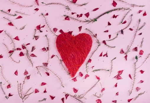 Valentine's day background design. Top view of valentine heart and flowers pattern over pink background. Flat lay.