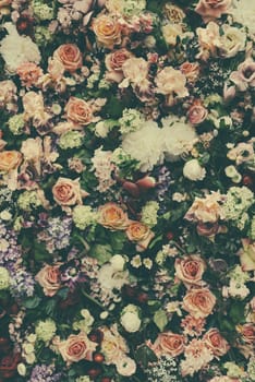 Fresh flower pattern background for vintage wedding decoration and invitation design layout. Floral bouquet wall arrangement in retro style pastel colors.
