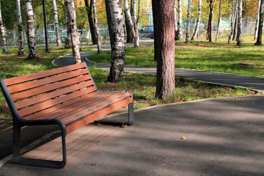 City park with paths and benches. Place for rest and walks. urban architecture