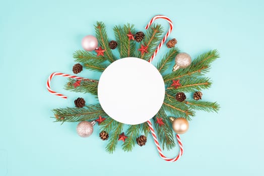 Christmas holiday background, frame with fir branches, baubles, candy cane and cones, winter season greeting card