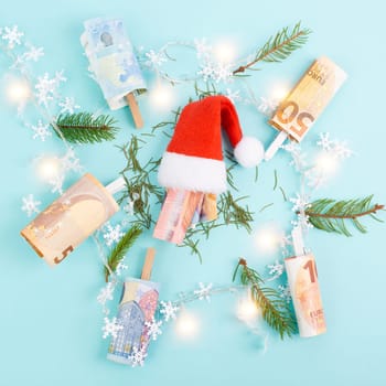 Christmas fairy lights with money, increase of electricity costs, save energy at the holiday season