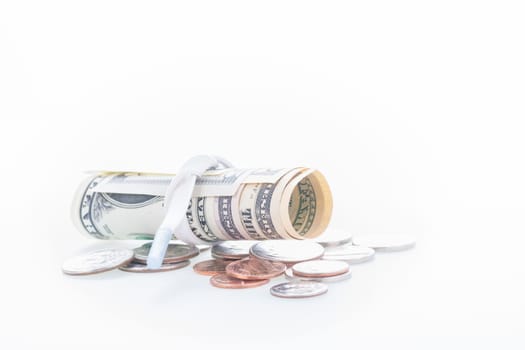 Shoestring budget concept with US dollars and coins