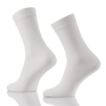 Close up of white cotton long sock on invisible foots isolated on white background. Layout for advertising, branding, design or template.